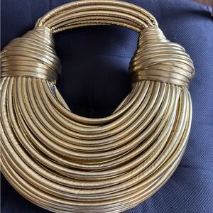 Elegant Gold Women's handbag with zippered interior